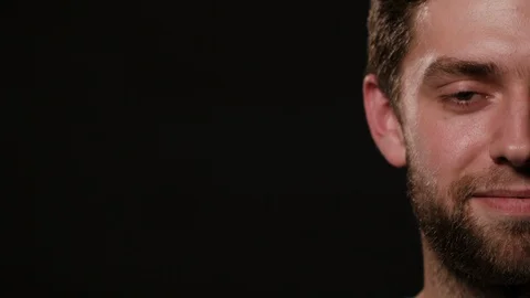 Man's Half Face Against a Black Background Stock Footage 88453142
