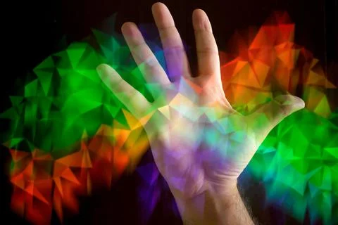 Man's hand with abstract multicolored patterns. Concept of aura or energy. Foto stock