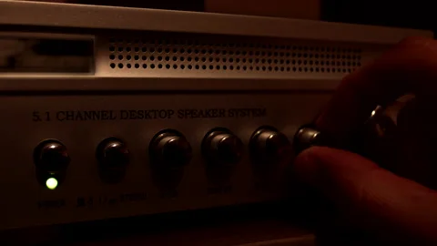 Man's hand adjusts amplifier levels for sounds. Stock Footage 237152815