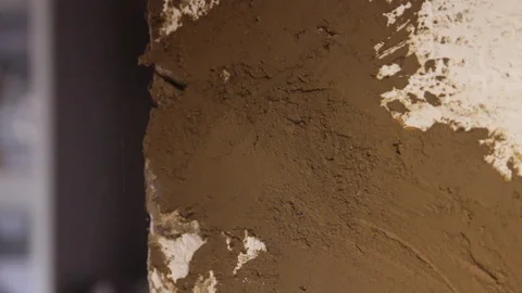 Man's hand aligns the corner of the wall Stock Footage 122645435