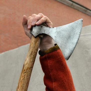 Man's hand on ancient broadaxe 2 Stock Photos