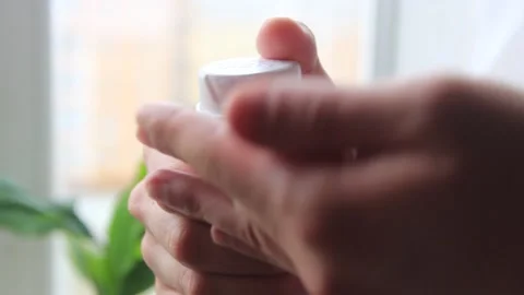 Man's hand applying shaving foam from a spray can to the other hand Stock Footage 169515246