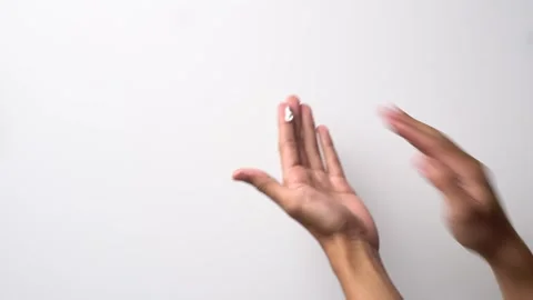 Man's hand applying sunscreen on hand area with white background Stock Footage 262434950