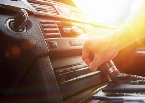 A man's hand on an automatic gearbox. Automatic shift transmission. Stock Photos