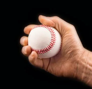 Man's hand with a baseball ball Stock Photos