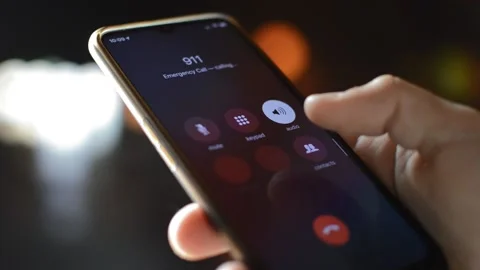 Man's hand calling 911 emergency number. emergency service telephone technology Video stock 172488216