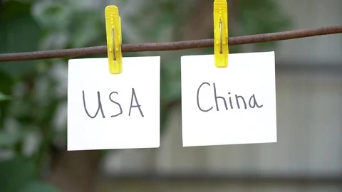 Man’s hand change and take away white papers with words on yellow clothespins. Stock Footage 108775827