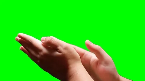 A man's hand clapping on a green screen background Stock Footage 340356931