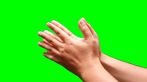A man's hand clapping on a green screen background Stock Footage 340356932