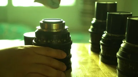 Man's hand cleaning camera lens 動画素材 83305817