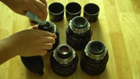 Man's hand cleaning camera lens 動画素材 83309581