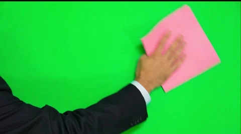 Man's Hand Cleaning Green Surface With Rag - On A Green Screen Stock-Footage 56598170