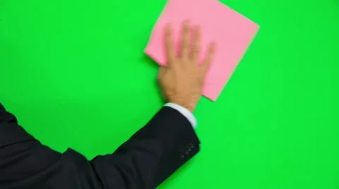 Man's Hand Cleaning Green Surface With Rag - Left And Right Motion Stock-Footage 56598755