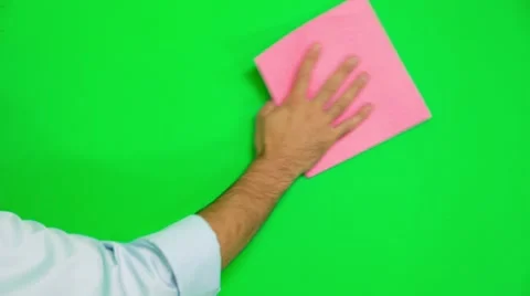 Man's Hand Cleaning Green Surface With Rag - On A Green Screen Stock-Footage 56714849