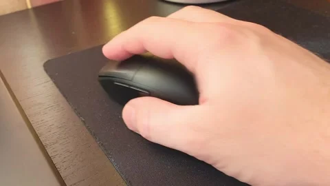 Man's Hand Clicking and Scrolling on a Wireless Computer Mouse, 4K Close Up Stock Footage 318616477