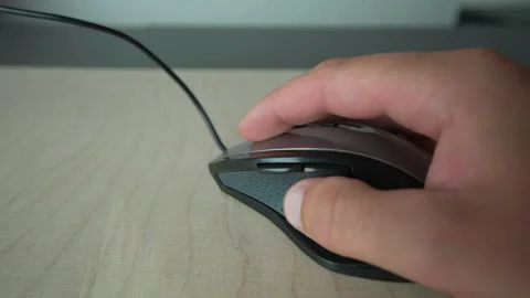 Mans hand clicking on computer mouse Stock Footage 158633966