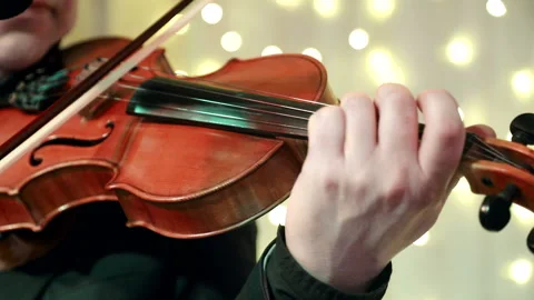 Man's hand close-up playing the violin during a Banquet in a restaurant Video stock 104516734