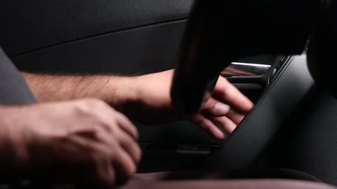 A man’s hand closes the door inside the car Stock Footage 275145798