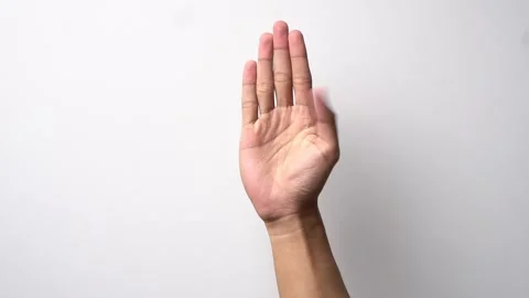 Man's hand with a coded gesture asking for help on a white background Stock Footage 262434702