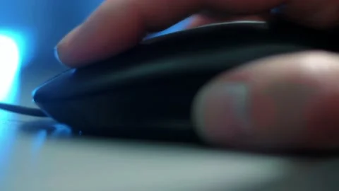 A man's hand on a computer mouse in close-up Stock Footage 159805479