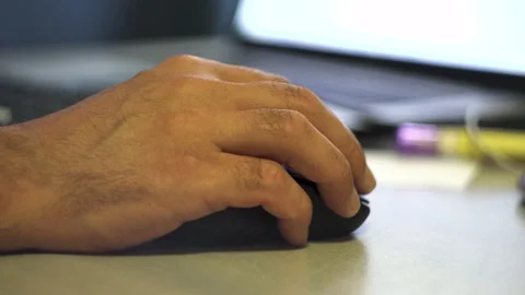 Man's hand controls a computer mouse 4K Stock Footage 201611829