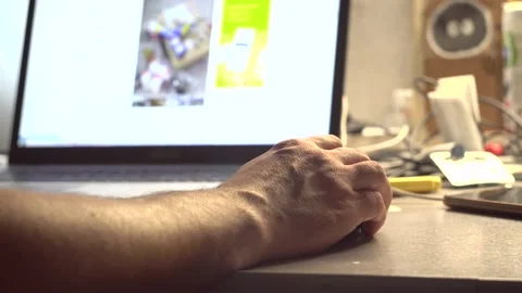 Man's hand controls a computer mouse  - 4K Stock Footage 201611833