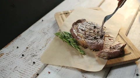 Man's hand cut steak meat dish Stock Footage