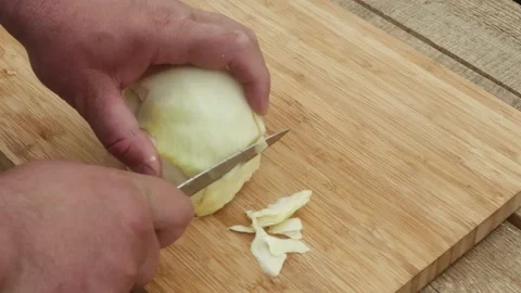 Man's hand cuts cabbage with a knife Vídeos de archivo 195397898