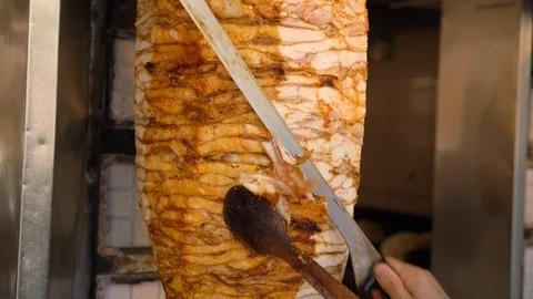 Man's hand cutting and preparing meat for Doner kebab Stock Footage 118922414
