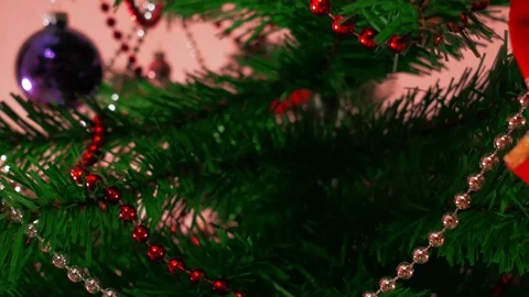 Mans hand decorating christmas tree. Close Up Stock Footage 83861193