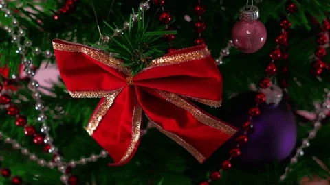 Mans hand decorating christmas tree. Close Up Stock Footage 83864561