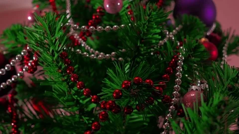 Mans hand decorating christmas tree. Close Up Stock Footage 83864948