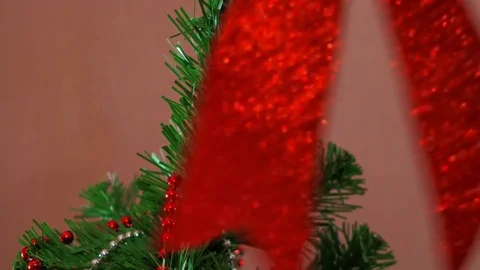 Mans hand decorating christmas tree Stock Footage 84171125