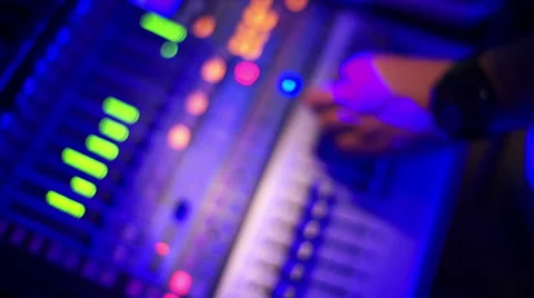 Man's hand decreasing the volume on the mixing console. Stock Footage 61965223