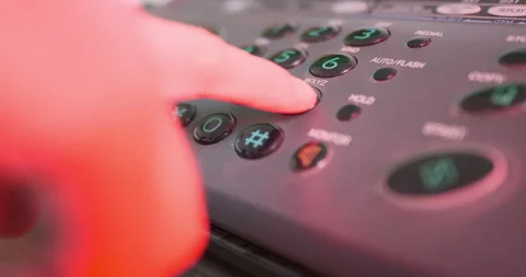 Man's hand dials 911 rescue service on an old push-button telephone. Side view Vídeos de archivo 235925296