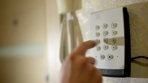 Man's hand dials the code from the security system at home on a keypad with 스톡 동영상 151783748
