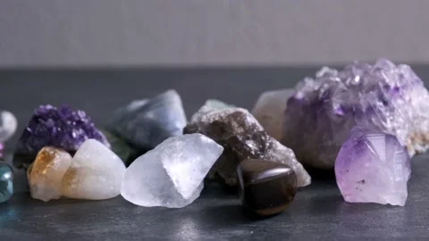 A man's hand with different semi-precious stones Stock Footage 223668043