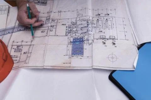 A man's hand draws a construction drawing Stock Photos