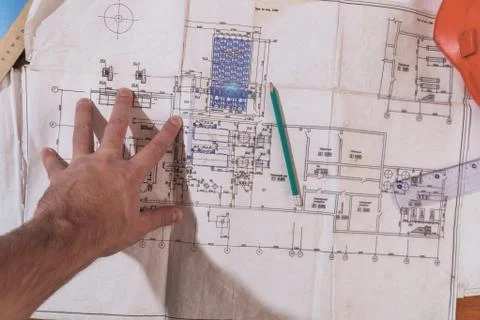 A man's hand draws a construction drawing Stock-Fotos