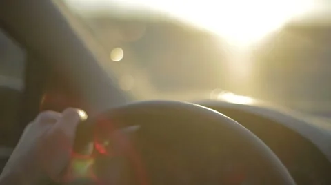 Man's hand is driving car at sunset Stock Footage 48225009