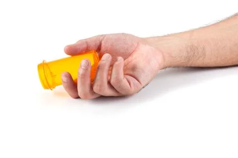 Man's hand with empty pill bottle Stock Photos