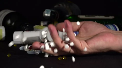 Man's hand falling on the table after committing a suicide Video stock 68403906