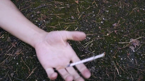 Man's hand Falls to floor just pricked heroin or meth drugs. Видео 78065875