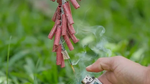 Man’s hand firing the firecracker Stock Footage 72273026