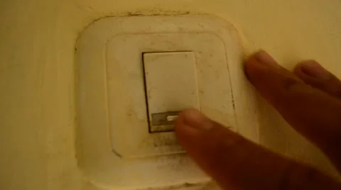 A man's hand flips a light switch on, and then turns it off. 스톡 동영상 51685917