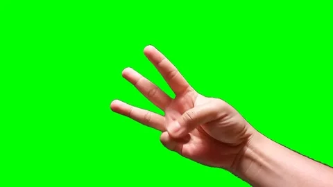 A man's hand forming a countdown on a green screen background Stock Footage 340356939