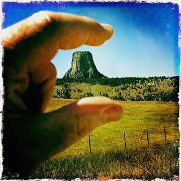 Man's hand framing the Devil's Tower Stock Photos