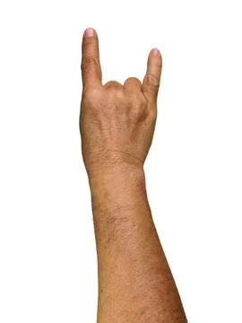 Man's hand gesturing rock and roll, heavy metal, devil horns gesture or I l.. Стоковые фото