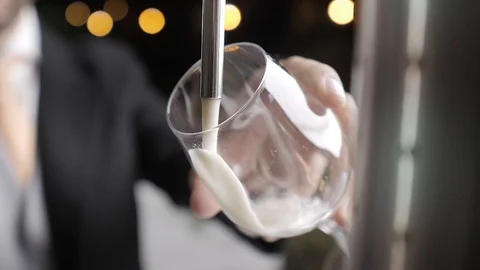 Man's hand with a glass serving draft beer Stock Footage 120462233