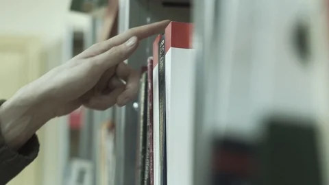 Mans Hand Grab Red Cross ICRC Book In Library Video stock 99307741